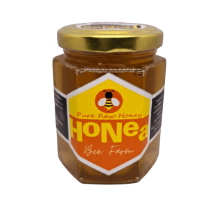 HoNea Pure Raw Honey 250g jar with golden cap, showing golden unfiltered honey locally harvested in Davao.